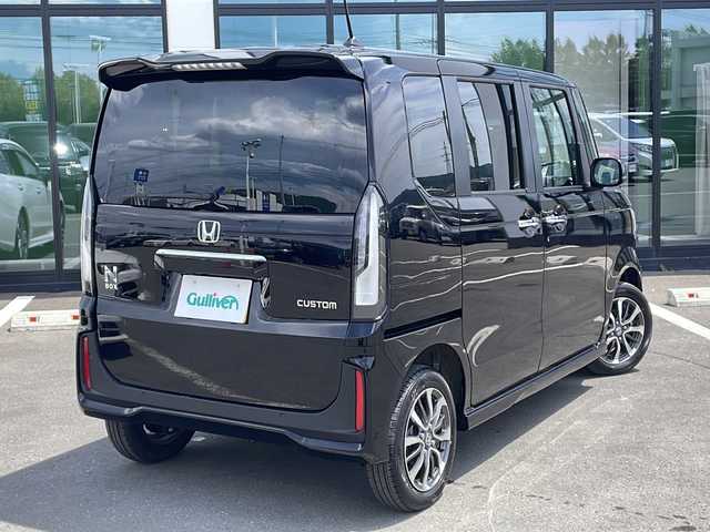 ホンダ Ｎ ＢＯＸ カスタム 道東・釧路十勝 2024(令6)年 1.1万km クリスタルブラックパール ・4WD/・社外SDナビ/（SD・FM・AM・AUX・BT・SMART USEN・DISC）/・バックカメラ/・ホンダセンシング/・レーダークルーズコントロール/・レーンキープアシスト/・コーナーセンサー/・片側パワースライドドア/・前席シートヒーター/・ミラーヒーター/・ETC/・電子制御パーキング/・ステアリングスイッチ/・LEDヘッドライト/・オートライト/・ヘッドライトレベライザー/・横滑り防止/・電格ウィンカーミラー/・スマートキー/・プッシュスタート
