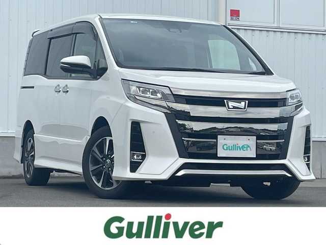 トヨタ ノア Si ダブルバイビーⅡ 愛媛県 2020(令2)年 5.3万km ホワイトパールクリスタルシャイン 純正ナビ（Bluetooth/フルセグTV/DVD再生可能）/純正後席モニター/ETC2.0/バックカメラ/両側パワースライドドア/ハーフレザー/USB/前方ドライブレコーダー/純正アルミホイール/純正フロアマット/前後コーナーセンサー/クルーズコントロール/3列シート/LEDヘッドライト/ABS/横滑り防止装置/レーンキープアシスト/盗難防止装置/オートマチックハイビーム/Wエアバッグ/衝突被害軽減システム