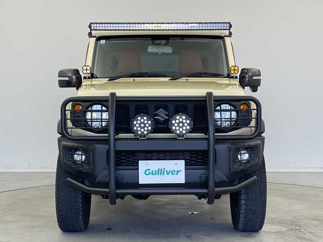 スズキ ジムニー シエラ JL 新潟県 2019(平31)年 1.9万km シフォンアイボリーM 4WD/社外SDナビ（型式：PVH-9300DVSZS）/・CD/DVD/Bluetooth/フルセグ/USB/ETC/前席シートヒーター/グリルガード/背面タイヤ/リヤタイヤカバー/純正LEDヘッドライト/オートライト/フロントフォグランプ/純正フロアマット/純正15インチAW夏タイヤ/ABS/盗難防止装置/センターデフロック/ダウンヒルアシストコントロール