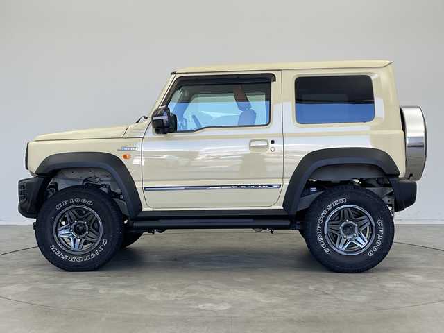 スズキ ジムニー シエラ JL 新潟県 2019(平31)年 1.9万km シフォンアイボリーM 4WD/社外SDナビ（型式：PVH-9300DVSZS）/・CD/DVD/Bluetooth/フルセグ/USB/ETC/前席シートヒーター/グリルガード/背面タイヤ/リヤタイヤカバー/純正LEDヘッドライト/オートライト/フロントフォグランプ/純正フロアマット/純正15インチAW夏タイヤ/ABS/盗難防止装置/センターデフロック/ダウンヒルアシストコントロール