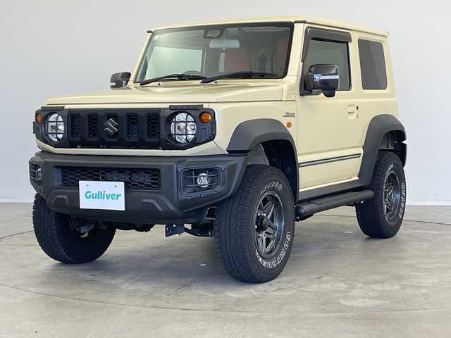 スズキ ジムニー シエラ JL 新潟県 2019(平31)年 1.9万km シフォンアイボリーM 4WD/社外SDナビ（型式：PVH-9300DVSZS）/・CD/DVD/Bluetooth/フルセグ/USB/ETC/前席シートヒーター/グリルガード/背面タイヤ/リヤタイヤカバー/純正LEDヘッドライト/オートライト/フロントフォグランプ/純正フロアマット/純正15インチAW夏タイヤ/ABS/盗難防止装置/センターデフロック/ダウンヒルアシストコントロール