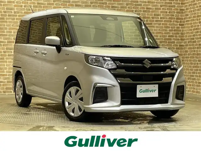 スズキ ソリオ HV MG 岩手県 2025(令7)年 1.6万km スターシルバーメタリック ４WD/スズキセーフティサポート/デュアルセンサーブレーキサポート２/車線逸脱抑制機能/アダプティブクルーズコントロール/車線維持支援機能/標識認識機能/先行車・青信号発信お知らせ/誤発進抑制機能/低速時ブレーキアシスト/パーキングセンサー/横滑り防止装置/アイドリングストップ/オートライト/ヘッドライトレベライザー/助手席アンダーボックス/社外ナビ/ワンセグTV/15インチスチールホイール/純正ホイールキャップ