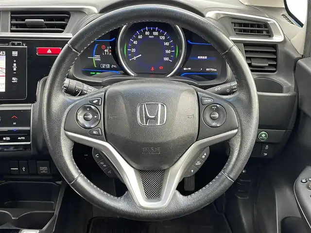 ホンダ フィット ハイブリット Lパッケージ 福岡県 2013(平25)年 8.8万km ビビットスカイブルーP 純正ナビ（ＣＤ　ＤＶＤ　フルセグ　Ｂｌｕｅｔｏｏｔｈ　ＨＤＭＩ）　バックカメラ　シティブレーキアクティブシステム　ビルトインＥＴＣ　スマートキー　プッシュスタート　クルーズコントロール　ハーフレザー