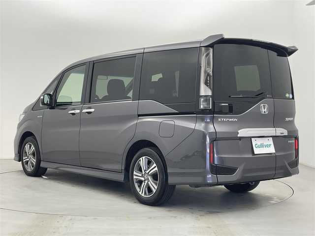ホンダ ステップワゴン スパーダ ハイブリッド G ホンダセンシング 富山県 2019(平31)年 2.7万km モダンスティールM 社外ナビ（AM/FM/CD/BT/USB/SD）/バックカメラ/前後ドライブレコーダー/両側パワースライドドア/レーダークルーズコントロール/衝突軽減ブレーキ/レーンキープアシスト/スマートキー/スペアキー有/プッシュスタート/LEDヘッドライト/オートライト/ビルトインETC/電動パーキングブレーキ/オートブレーキホールド/横滑り防止装置/革巻きステアリング/純正フロアマット/保証書/取扱説明書