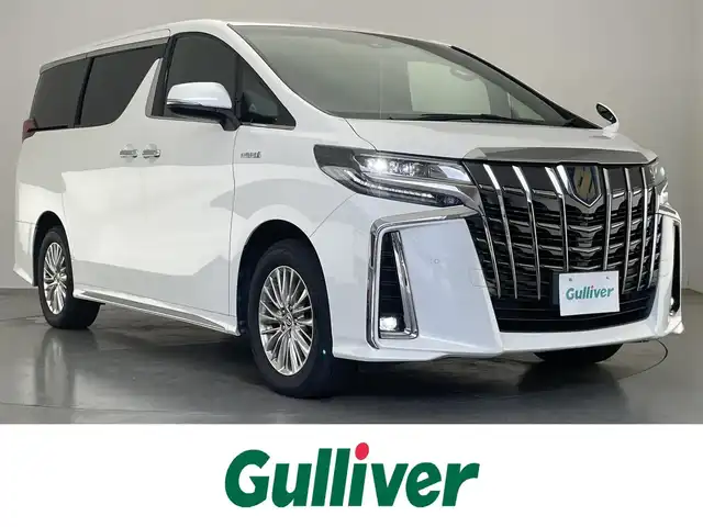 トヨタ アルファードハイブリット S タイプゴールド 愛知県 2021(令3)年 3.5万km ホワイトパールクリスタルシャイン 純正９型ナビ　ＢＳＭ　デジタルインナーミラー　両側パワスラ　追従クルコン　セーフティセンス　フルセグ　ＢＴ　ＥＴＣ　バックカメラ　車線逸脱　衝突軽減　ＬＥＤライト　コーナーセンサー　ＡＣ１００Ｖ電源　電動リアゲート　オットマン　
