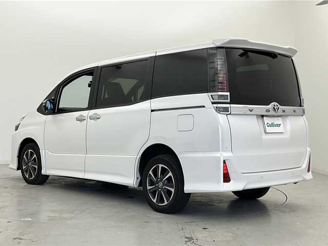 トヨタ ヴォクシー ZS 煌Ⅲ 宮城県 2021(令3)年 2.6万km ホワイトパールクリスタルシャイン 禁煙車/ワンオーナー/4WD/Toyota Safety Sense /・プリクラッシュセーフティ/・レーンディパーチャーアラート/・オートマチックハイビーム/クルーズコントロール/クリアランスソナー/寒冷地仕様/・ワイパーデアイサー/・ミラーヒーター/純正12型フリップダウンモニター/純正10型ナビ/・BT.CD.DVD.SD/・フルセグTV/バックカメラ/両側パワースライドドア/ハーフレザーシート/ビルトインETC/ドライブレコーダー（FR）/プッシュスタート/スマートキー/LEDヘッドライト/LEDフォグライト/純正フロアマット/純正16インチAW