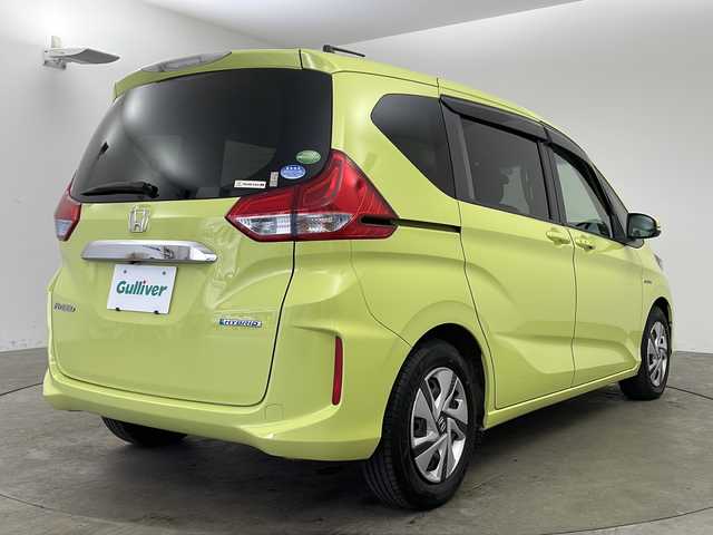 ホンダ フリード ハイブリット G ホンダセンシング 兵庫県 2016(平28)年 7.3万km シトロンドロップ ・純正ナビ（VXM-175VFNi）/・CD/DVD/BT/フルセグTV/・バックカメラ/・ホンダセンシング/・衝突軽減ブレーキ/・誤発進抑制機能/・アダプティブクルーズコントロール/・車線維持支援システム/・歩行者事故低減ステアリング/・路外逸脱抑制機能/・先行車発進お知らせ機能/・標識認識機能/・LEDヘッドライト/・オートライト/・フォグランプ/・コンフォートビューパッケージ/・Cパッケージ/・前後ドライブレコーダー（GL-03AP）/・純正フロアマット/・純正ドアバイザー/・プラズマクラスター/・サンシェード/・スマートキー/・スペアキー/・プッシュスタート