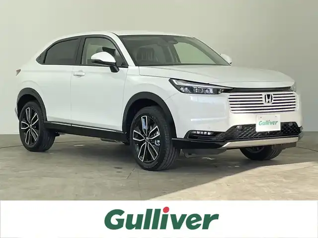ホンダ ヴェゼル ハイブリッド e:HEV Z 千葉県 2025(令7)年 0.1千km プラチナホワイトパール 登録済未使用車　/登録時走行距離：5km/純正ホンダコネクトナビ　/AM＆FM＆Bluetooth＆フルセグTV/ホンダセンシング　/レーダークルーズコントロール　/踏み間違い衝突軽減システム　/ブラインドスポットモニター/シートヒーター　/電動トランク　/ダウンヒルアシスト　/ビルトインＥＴＣ2.0/ワイヤレス充電/電動格納サイドミラー/電動パーキングブレーキ/オートホールド/Driveモード/前後コーナーセンサー/LEDヘッドライト（オートライト機能付き）/フォグランプ/トノカバー/USBポート/アイドリングストップ/ウィンカーミラー/プッシュスタート