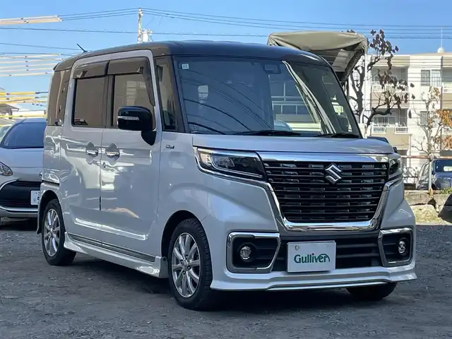 スズキ スペーシア カスタム HYBRID XS ターボ 東京都 2018(平30)年 4.1万km ピュアホワイトパール/ブラック2トーン ターボ/社外メモリナビ(CN-RZ743W)/　(フルセグTV/Bluetooth/DVD/SD/USB)/バックカメラ/ETC/前後ドライブレコーダー/両側パワースライドドア/ハーフレザーシート/D席シートヒーター/レザー調シートカバー/クルーズコントロール/スズキ セーフティ サポート/・デュアルセンサーブレーキサポート/・車線逸脱警報機能/・先行車発進お知らせ機能/・後退時ブレーキサポート/・リヤパーキングセンサー/・誤発進抑制機能/・ふらつき警報機能/・ハイビームアシスト/・後方誤発進抑制機能/横滑り防止装置/パドルシフト/スマートキー/社外14インチアルミホイール/(純正15インチアルミ車載)/純正LEDヘッドライト/カーテンエアバック/スペアキー1本/保証書/取扱説明書