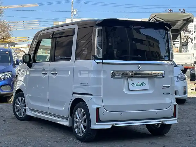 スズキ スペーシア カスタム HYBRID XS ターボ 東京都 2018(平30)年 4.1万km ピュアホワイトパール/ブラック2トーン ターボ/社外メモリナビ(CN-RZ743W)/　(フルセグTV/Bluetooth/DVD/SD/USB)/バックカメラ/ETC/前後ドライブレコーダー/両側パワースライドドア/ハーフレザーシート/D席シートヒーター/レザー調シートカバー/クルーズコントロール/スズキ セーフティ サポート/・デュアルセンサーブレーキサポート/・車線逸脱警報機能/・先行車発進お知らせ機能/・後退時ブレーキサポート/・リヤパーキングセンサー/・誤発進抑制機能/・ふらつき警報機能/・ハイビームアシスト/・後方誤発進抑制機能/横滑り防止装置/パドルシフト/スマートキー/社外14インチアルミホイール/(純正15インチアルミ車載)/純正LEDヘッドライト/カーテンエアバック/スペアキー1本/保証書/取扱説明書