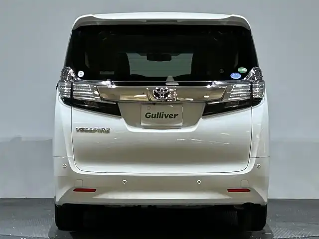 トヨタ ヴェルファイア V 愛媛県 2017(平29)年 6万km ホワイトパールクリスタルシャイン 純正ナビ/(AM/FM/CD/DVD/フルセグ/Bluetooth)/バックカメラ/純正フリップダウンモニター/両側パワースライドドア/クルーズコントロール/運転席パワーシート/シートメモリー/衝突被害軽減ブレーキ/純正ドライブレコーダー/ビルトインＥＴＣ　/ステアリングリモコン/ＬＥＤヘッドライト/オットマン/キャプテンシート/取扱説明書