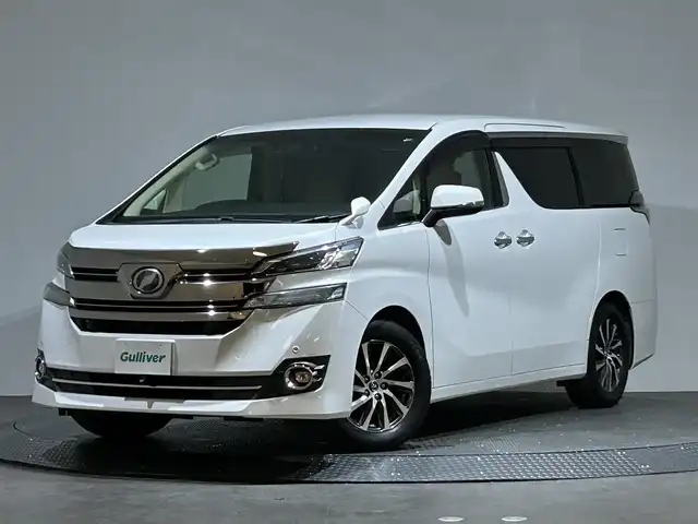 トヨタ ヴェルファイア V 愛媛県 2017(平29)年 6万km ホワイトパールクリスタルシャイン 純正ナビ/(AM/FM/CD/DVD/フルセグ/Bluetooth)/バックカメラ/純正フリップダウンモニター/両側パワースライドドア/クルーズコントロール/運転席パワーシート/シートメモリー/衝突被害軽減ブレーキ/純正ドライブレコーダー/ビルトインＥＴＣ　/ステアリングリモコン/ＬＥＤヘッドライト/オットマン/キャプテンシート/取扱説明書