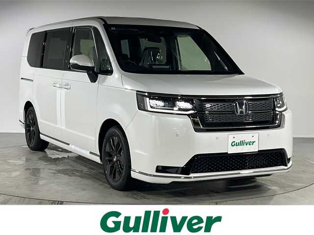 ホンダ ステップワゴン スパーダ eHEV 福岡県 2025(令7)年 0.1万km未満 パール 純正ナビ【LXM-247VFLi】/追従クルーズコントロール/両側パワースライドドア/Bluetooth/シートヒーター【運転席+助手席】/ブラインドスポットモニター/バックモニター/前後コーナーセンサー/衝突軽減ブレーキ/踏み間違い衝突軽減システム/先行車発信お知らせ/盗難防止装置/横滑り防止装置/オットマン/ワンセグ/DVD/CD/HDMI/スペアキー/純正アルミニウム/パドルシフト/スマートキー/プッシュスタート