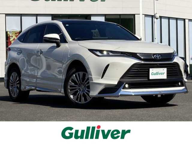 トヨタ ハリアー Z レザーパッケージ 佐賀県 2020(令2)年 4.1万km ホワイトパールクリスタルシャイン モデリスタエアロ/調光パノラマルーフ/純正12.3インチナビ/JBLサウンドシステム/パノラマミックビューモニター/プリクラッシュセーフティ/レーンディパーチャーアラート/オートハイビーム/アダプティブクルーズコントロール/クリアランスソナー/ブラインドスポットモニター/リアクロストラフィックアラート/ヘッドアップディスプレイ/スマートルームミラー（前方録画機能付き）/レザーシート/メモリパワーシートシート/シートヒーター/エアシート/パワーバックドア/電動パーキングブレーキ/オートブレーキホールド/ステアリングヒーター/ステアリングスイッチ/ETC/プッシュスタート/スマートキー/LEDヘッドライト/フォグライト/純正アルミホイール