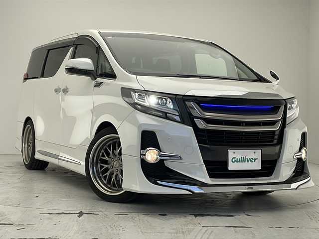 トヨタ アルファード S Aパッケージ 沖縄県 2017(平29)年 4.7万km ホワイトパールクリスタルシャイン ワンオーナー/純正10型ナビ（NSZN-Z66T）/　CD/DVD/SD/BT/フルセグ/バックカメラ/純正12.1型フリップダウンモニター（V12T-R66C)（MOP)/モデリスタフルエアロ/モデリスタグリル・バックドア・フェンダーガーニッシュ/モデリスタサス/ビルトインETC/純正ドライブレコーダー（DRT-H66A）/インナーミラー型レーダー探知機/両側パワースライドドア/クルーズコントロール/クリアランスソナー/アイドリングストップ（MOP)/アクセサリーコンセントAC100V・100W(MOP)/LEDヘッドライト/オートライト/社外20インチAW/純正18インチAW付き夏タイヤ積込/スペアタイヤ（MOP)/プッシュスタート/スマートキー/スペアキー/保証書/取扱説明書