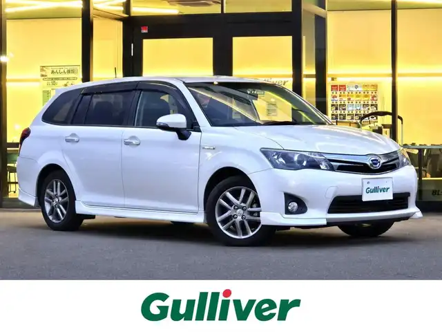 トヨタ カローラ フィールダー HV G エアロツアラー W×B 東京都 2015(平27)年 9.4万km ホワイトパールクリスタルシャイン 純正７インチナビ（NSZT-W64）　/・Bluetooth接続/・ワンセグTV/ドライブレコーダー/バックカメラ/純正フロアマット/純正15インチアルミホイール/ハーフレザーシート/AACエアコン（nanoe）/ドアバイザー/ETC