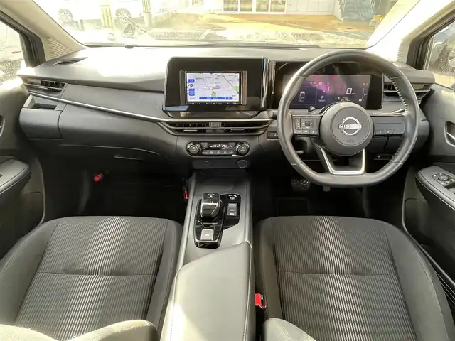 日産 ノート X FOUR 島根県 2023(令5)年 6.9万km ダークメタルグレー 4WD/社外メモリナビ　/(AM/FM/Ｂｌｕｅｔｏｏｔｈ接続)/前方ドライブレコーダー/ＥＴＣ　/バックカメラ　/インテリジェント　エマージェンシーブレーキ/レーンアシスト/後側方車両検知警報システム/前後コーナーセンサー/前席シートヒーター　/ステアリングヒーター/電動パーキングブレーキ/オートホールド　/オートハイビーム/ライト　/純正フロアマット/スペアキー1本