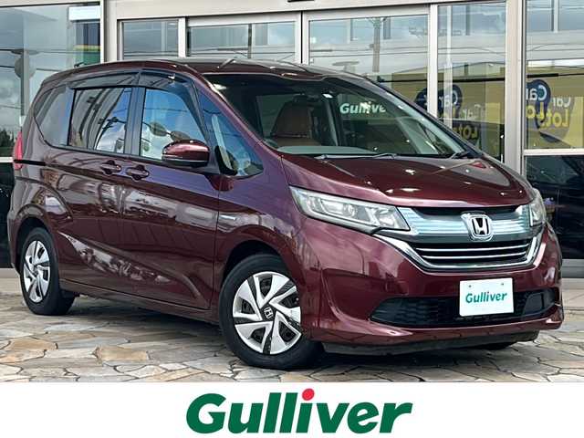 ホンダ フリード ハイブリット G ホンダセンシング 静岡県 2017(平29)年 5.4万km プレミアムディープロッソパール 純正SDナビ/・CD/・DVD/・フルセグＴＶ/・Bluetooth/・USB/・AM/・FM/主要装備/・両側パワスラ/・ホンダセンシング/・衝突軽減/・レーンキープ/・追従クルコン/・バックカメラ/・ETC/・ドラレコ前/・純正フロアマット/・LEDヘッドライト/・オートライト/・ステアリングスイッチ/・スマートキー/・プッシュスタート/・フェイクレザーシートカバー/・スペアキー1本