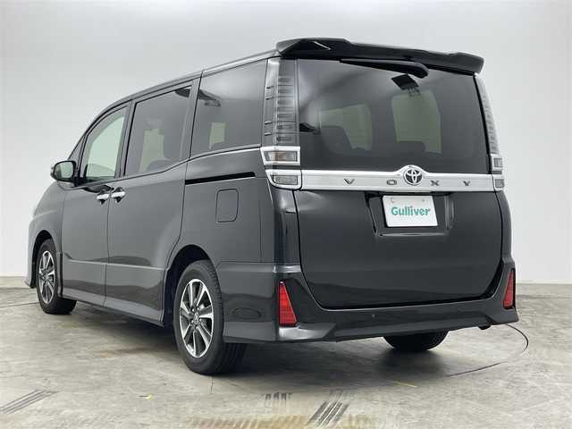 トヨタ ヴォクシー ZS 煌Ⅱ 岡山県 2019(令1)年 9.4万km ブラック アルパイン１１インチナビ/【Bluetooth/フルセグTV/Carplay/CD/DVD】/１２．８インチフリップダウンモニター/両側電動スライドドア/クルーズコントロール/ＬＥＤヘッドライト/オートハイビーム/社外ドライブレコーダー（前）/バックカメラ/衝突軽減ブレーキシステム/ビルトインＥＴＣ/純正フロアマット/後席サンシェイド