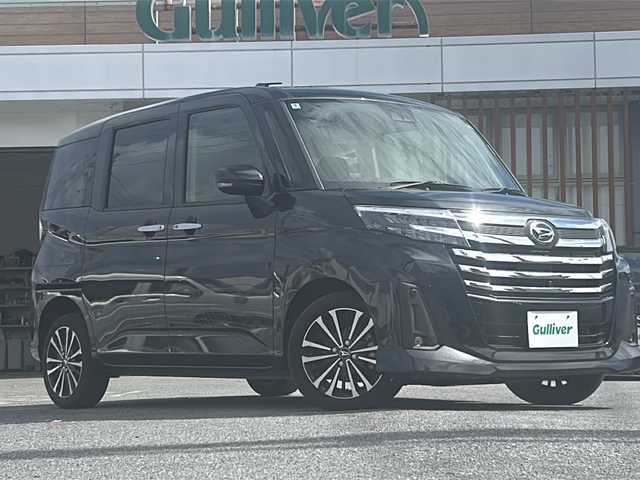 ダイハツ トール カスタムG ターボ 沖縄県 2024(令6)年 0.4万km ブラックマイカメタリック 9インチディスプレイオーディオ・TV・Bluetooth/全方位カメラ/両側パワースライドドア/オートライト/衝突軽減システム/コーナーセンサー/オートホールド/リアロールサンシェード/ステアリングスイッチ/電動格納ミラー/LEDヘッドライト/純正アルミ