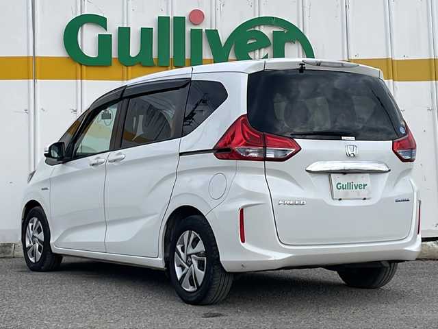 ホンダ フリード ハイブリット G ホンダセンシング 福井県 2018(平30)年 5.1万km ホワイトオーキッドパール 外部検査実施済み/純正メモリナビ＆フルセグＴＶ【VXM-187VFNi】/　（ＤＶＤ＆ＣＤ＆ＭＳＶ＆ＢＴ＆ＵＳＢ）/フリップダウンモニター/バックカメラ/ビルトインＥＴＣ/前方ドライブレコーダー/衝突軽減ブレーキ/レーンアシスト/レーダークルーズコントロール/先行車発進告知/標識認識機能/アイドリングストップ/革調シートカバー/両側パワースライドドア/オートライト/ＬＥＤライト/電動格納ミラー/スマートキー/プッシュスタート/Ｗエアバッグ/横滑り防止装置/盗難防止装置/ＡＢＳ/ドアバイザー/フロアマット/新車保証書/取扱説明書/スマートスペアキー有