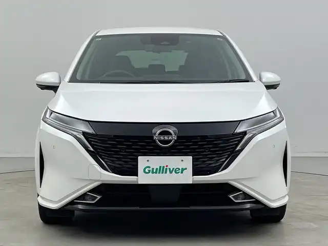日産 オーラ G 新潟県 2022(令4)年 3.5万km ピュアホワイトパール KENWOODメモリナビ【MDV-D308BT】/　Bluetooth/CD/DVD/USB/衝突被害軽減ブレーキ/レーンキープアシスト/ブラインドスポットモニター/アラウンドビューモニター/インテリジェントルームミラー/ドライブレコーダー/ハーフレザーシート/前後コーナーセンサー/オートマチックハイビーム/ビルトインETC/横滑り防止装置/LEDヘッドライト/レザーステアリング