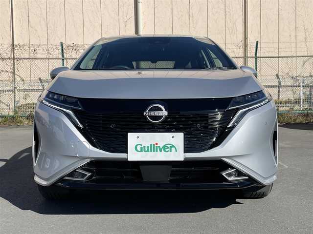 日産 オーラ G FOUR レザーエディション 道北・旭川 2024(令6)年 0.1万km ブリリアントシルバー アラウンドビューモニター/インテリジェントルームミラー/エマージェンシーブレーキ/車線逸脱警報/アダプティブヘッドライト/シートヒーター/ステアリングヒーター/スマートキー/ステアリングスイッチ
