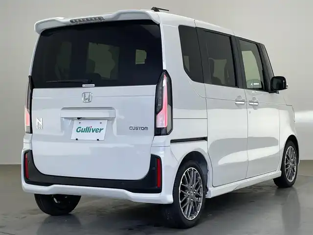 ホンダ Ｎ ＢＯＸ カスタム ターボ 愛知県 2025(令7)年 0.1万km プラチナホワイトパール 純正９型ナビ　フルセグＴＶ　カープレイ対応　全方位カメラ　ハーフレザー　シートヒーター　両側パワースライドドア　ホンダセンシング　衝突軽減　追従クルコン　ＬＥＤオートライト　コーナーセンサー パドルシフト　USB　マルチビューカメラシステム　禁煙車