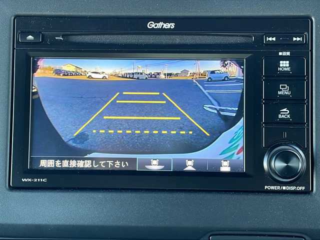 ホンダ Ｎ ＢＯＸ カスタム L 富山県 2023(令5)年 1.4万km クリスタルブラックパール 4WD/禁煙車/純正ディスプレイオーディオ/  (CD/BT/ワンセグTV)/バックカメラ/ホンダセンシング/  衝突軽減ブレーキ(CMBS)/  誤発進抑制機能/  歩行者事故低減ステアリング/  路外逸脱抑制機能/  アダプティブクルーズコントロール(ACC)/  車線維持支援システム(LKAS)/  先行車発進お知らせ機能/  標識認識機能/  後方誤発進抑制機能/  オートハイビーム/  パーキングセンサーシステム/LEDヘッドライト/フォグライト/サイド/カーテンエアバック/後席シートベルト締め忘れ警告灯/片側パワースライドドア/USBソケット/ステアリングリモコン/コーナーセンサー/シートヒーター/ミラーヒーター/ウィンカーミラー/電動格納ミラー/滑り防止装置/ベンチシート/ドアバイザー/純正フロアマット/運転席シートリフター/純正エンジンスターター/スマートキー/エンジンプッシュスタート/スペアキー/純正14インチアルミホイール/純正フロアマット/取扱説明書/保証書/ナビ取説