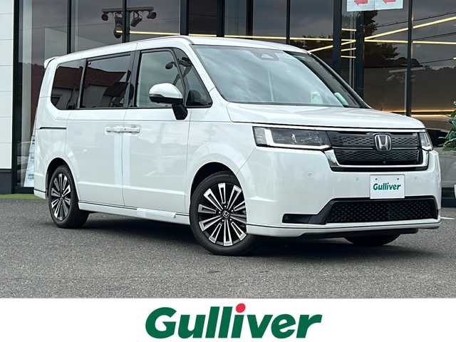 ホンダ ステップワゴン スパーダ eHEV プレミアムライン 大阪府 2025(令7)年 0.1千km プラチナホワイトパール 登録時走行距離32km ホンダセンシング　１０型ディスプレイオーディオ　両側パワースライドドア　レーダークルーズコントロール　ＢＳＭ　ハーフレザーシート　プラズマクラスター　パワーバックドア　１・２列目シートヒーター　ＥＴＣ