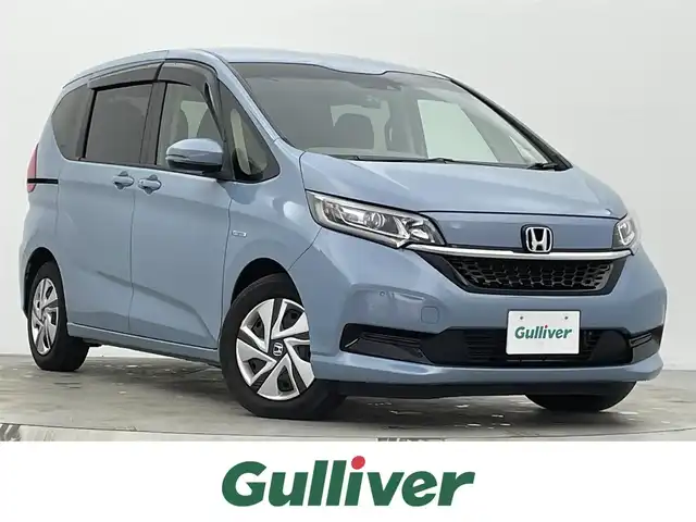 ホンダ フリード ハイブリット G ホンダセンシング 宮城県 2021(令3)年 3.8万km シーグラスブルーパール 純正ナビ/ホンダセンシング/両側電動スライド/ハンズフリーオートスライド/アダプティブクルーズコントロール/衝突軽減ブレーキ/レーンキープアシスト/バックモニター/ＬＥＤヘッドライト/フロントウィンドウ熱線/シートヒーター/ビルトインＥＴＣ/フルセグTV/Bluetoothオーディオ/前後ドライブレコーダー