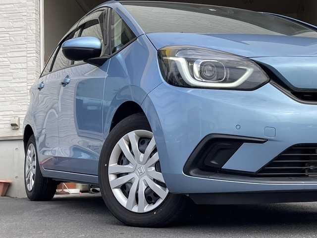ホンダ フィット ホーム 大分県 2022(令4)年 0.7万km ライトブルー ワンオーナー /純正ナビ/純正フロアマット/純正LEDヘッドライト/オートライト/バックカメラ/横滑り防止装置/衝突被害軽減ブレーキ/クルーズコントロール/スマートキー