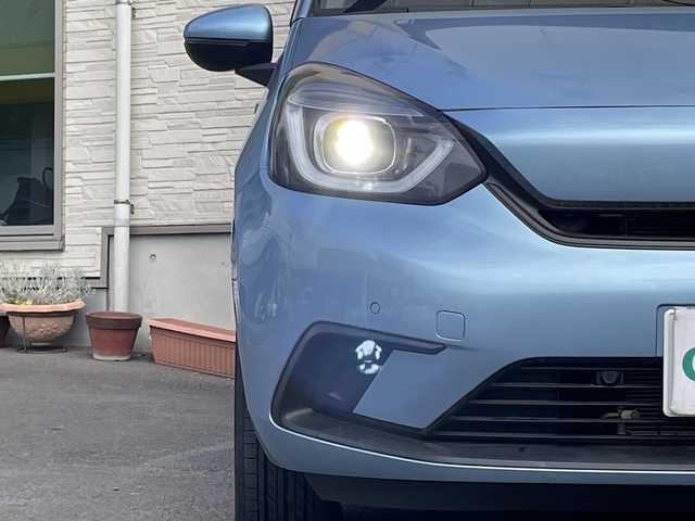 ホンダ フィット ホーム 大分県 2022(令4)年 0.7万km ライトブルー ワンオーナー /純正ナビ/純正フロアマット/純正LEDヘッドライト/オートライト/バックカメラ/横滑り防止装置/衝突被害軽減ブレーキ/クルーズコントロール/スマートキー