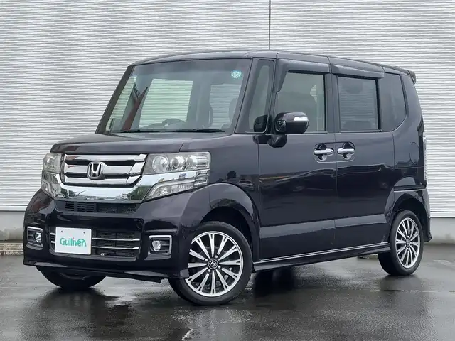 ホンダ Ｎ ＢＯＸ カスタム G ターボ Lパッケージ 山形県 2015(平27)年 8.7万km プレミアムベルベットパープル・パール ４WD/ターボ/両側パワスラ/社外ナビ/フルセグ/バックカメラ/純正アルミ/スマートキー/アイドリングストップ/プッシュスタート/クルーズコントロール/ステアリングスイッチ/前席シートヒーター/パドルシフト/ETC/純正フロアマット/社外ドアバイザー/オートライト/オートエアコン/パワーステアリング/パワーウィンドウ/横滑り防止/盗難防止装置/寒冷地仕様/電動格納ウィンカーミラー