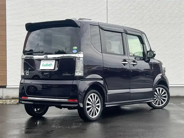 ホンダ Ｎ ＢＯＸ カスタム G ターボ Lパッケージ 山形県 2015(平27)年 8.7万km プレミアムベルベットパープル・パール ４WD/ターボ/両側パワスラ/社外ナビ/フルセグ/バックカメラ/純正アルミ/スマートキー/アイドリングストップ/プッシュスタート/クルーズコントロール/ステアリングスイッチ/前席シートヒーター/パドルシフト/ETC/純正フロアマット/社外ドアバイザー/オートライト/オートエアコン/パワーステアリング/パワーウィンドウ/横滑り防止/盗難防止装置/寒冷地仕様/電動格納ウィンカーミラー