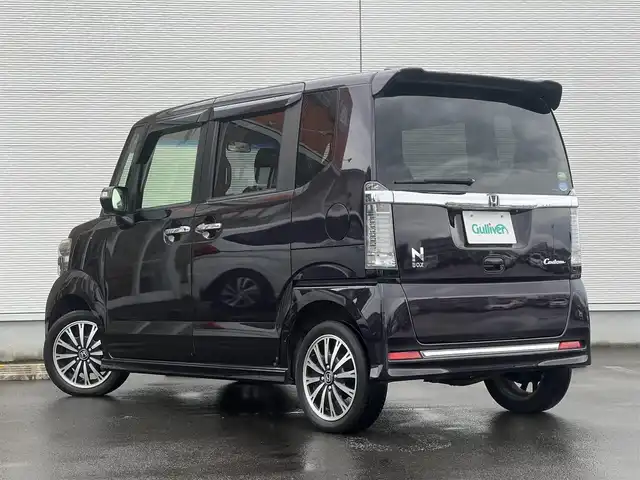 ホンダ Ｎ ＢＯＸ カスタム G ターボ Lパッケージ 山形県 2015(平27)年 8.7万km プレミアムベルベットパープル・パール ４WD/ターボ/両側パワスラ/社外ナビ/フルセグ/バックカメラ/純正アルミ/スマートキー/アイドリングストップ/プッシュスタート/クルーズコントロール/ステアリングスイッチ/前席シートヒーター/パドルシフト/ETC/純正フロアマット/社外ドアバイザー/オートライト/オートエアコン/パワーステアリング/パワーウィンドウ/横滑り防止/盗難防止装置/寒冷地仕様/電動格納ウィンカーミラー