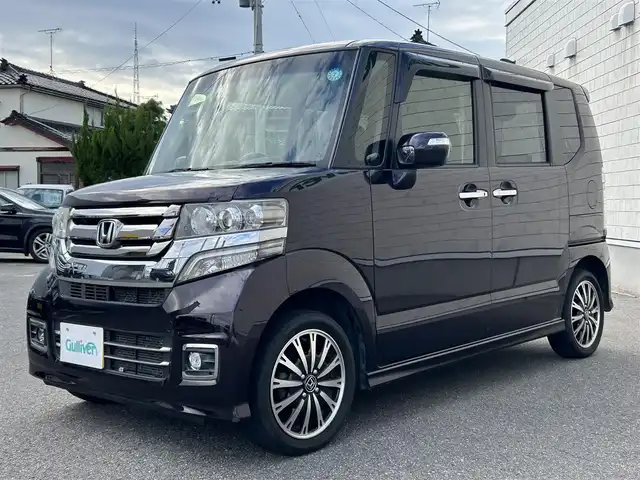 ホンダ Ｎ ＢＯＸ カスタム G ターボ Lパッケージ 山形県 2015(平27)年 8.7万km プレミアムベルベットパープル・パール 4WDターボ/両側パワースライドドア/社外ナビフルセグ/バックカメラ/純正アルミ/スマートキー/アイドリングストップ/プッシュスタート/クルーズコントロール/ステアリングスイッチ/前席シートヒーター/パドルシフト/ETC/純正フロアマット/オートライト/オートエアコン/寒冷地仕様/電動格納ウィンカーミラー