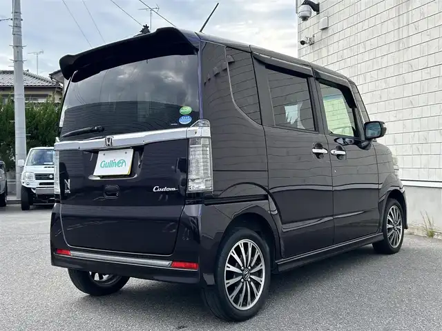 ホンダ Ｎ ＢＯＸ カスタム G ターボ Lパッケージ 山形県 2015(平27)年 8.7万km プレミアムベルベットパープル・パール 4WDターボ/両側パワースライドドア/社外ナビフルセグ/バックカメラ/純正アルミ/スマートキー/アイドリングストップ/プッシュスタート/クルーズコントロール/ステアリングスイッチ/前席シートヒーター/パドルシフト/ETC/純正フロアマット/オートライト/オートエアコン/寒冷地仕様/電動格納ウィンカーミラー