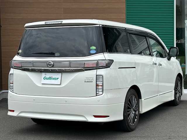 日産 エルグランド 250HWS プレミアム アーバンクロム 静岡県 2019(平31)年 7.3万km ブリリアントホワイトパール ワンオーナー/純正ナビ（フルセグTV、Bluetooth/後席モニター/前席パワーシート/レザーシート/両側パワースライドドア/オットマン/パワーバックドア/車外カメラ（バック/シートヒーター/ETC/純正アルミホイール/プッシュスタート/コーナーセンサー/ウォークスルー