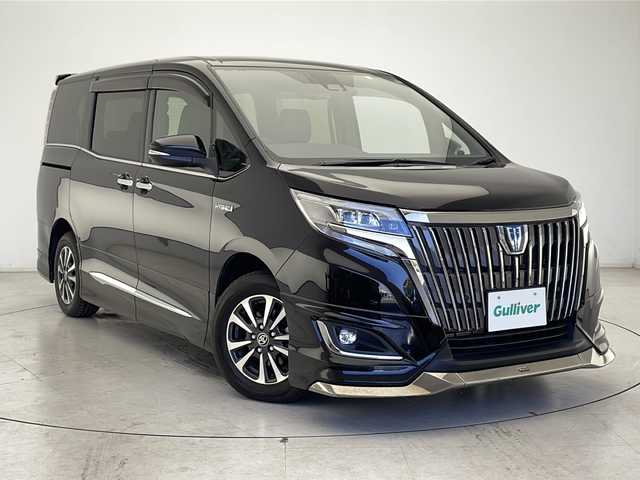 トヨタ エスクァイア ハイブリッド Gi プレミアムパッケージ ブラックテーラード 広島県 2020(令2)年 4.6万km ブラック ワンオーナー/純正SDナビ/フルセグテレビ/バックカメラ/CD/DVD/SD再生/Bluetooth接続/純正12.1インチフリップダウンモニター/ビルトインETC2.0/プッシュスタート/スマートキー（スペアキー1本）/電動格納ウィンカーミラー/純正15インチアルミホイール/ステアリングヒーター/前席シートヒーター/前後コーナーセンサー/クルーズコントロール/LEDヘッドライト/オートマチックハイビーム/トラクションコントロール/パーキングサポートブレーキ/先行車発進告知/レーンディパーチャーアラート/モデリスタエアロ