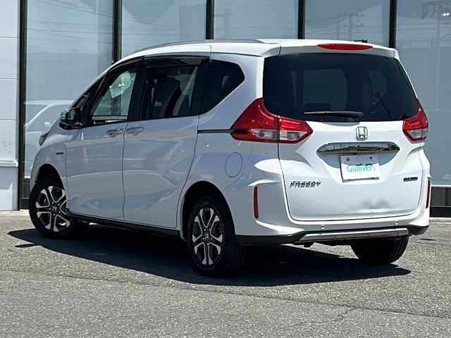 ホンダ フリード＋ ハイブリット クロスター ホンダセンシング 山形県 2020(令2)年 5.6万km プラチナホワイトパール ４WD/純正9インチメモリーナビ（BLUETOOTH/オーディオ/CD/DVD/フルセグ)/ALPINE後席モニター/レーダークルーズコントロール/衝突被害軽減システム/寒冷地仕様/DN席シートヒーター/ビルトインETC/スマートキー/純正アルミホイール/純正フロアマット/レーンキープアシスト/横滑り防止装置/ドアバイザー/電動格納ミラー/プッシュスタート/ウィンカーミラー