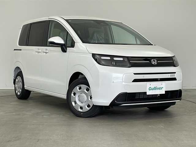 ホンダ フリード ハイブリット e:HEV AIR 新潟県 2025(令7)年 0.1万km未満 プラチナホワイトパール 4WD/純正9インチメモリナビ/(LXM-242ZFNi)/(フルセグ.Bluetooth.AppleCarPlay.AndroidAuto)/バックカメラ/ステアリングリモコン/LEDオートライト/両側パワースライドドア/ワイパーデアイサー/電動格納ウィンカーミラー/前席シートヒーター/プッシュスタート/スマートキー×2