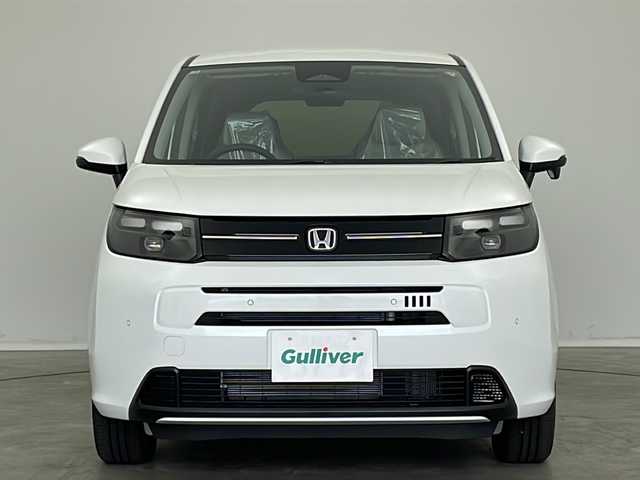 ホンダ フリード ハイブリット e:HEV AIR 新潟県 2025(令7)年 0.1万km未満 プラチナホワイトパール 4WD/純正9インチメモリナビ/(LXM-242ZFNi)/(フルセグ.Bluetooth.AppleCarPlay.AndroidAuto)/バックカメラ/ステアリングリモコン/LEDオートライト/両側パワースライドドア/ワイパーデアイサー/電動格納ウィンカーミラー/前席シートヒーター/プッシュスタート/スマートキー×2
