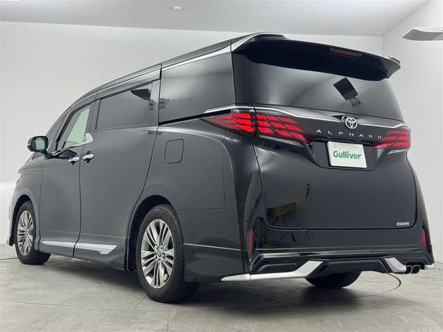トヨタ アルファード Z 愛知県 2023(令5)年 3.8万km ブラック トヨタチームメイト/純正14型ナビ（フルセグ、Bluetooth、HDMI）/純正12型後席モニター/モデリスタエアロ/BSM/全方位カメラ/ETC2.0/ACC/置くだけ充電/ACC/デジタルインナーミラー/ドラレコ前後/100V電源/両側パワスラドア/パーキングアシスト/パワーバックドア/パワーシート（D+N)/シートヒーター、エアシート/レーンキープアシスト/コーナーセンサー/衝突軽減ブレーキ/LEDヘッドライト/オートハイビーム/純正アルミホイール/社外フロアマット/三点エアバック/横滑り防止装置/スマートキー