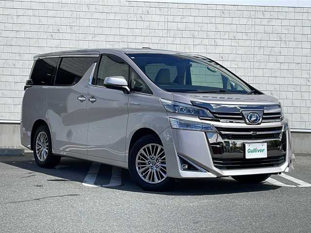 トヨタ ヴェルファイア ハイブリット V Lエディション 山形県 2018(平30)年 5.1万km スティールブロンドM 禁煙車/サンルーフ/レザーシート/Toyota Safety Sense/・プリクラッシュセーフティ/・レーントレーシングアシスト/・レーダークルーズコントロール/・ロードサインアシスト/・発進遅れ告知機能/・プロアクティブドライビングアシスト/・オートマチックハイビーム/JBLプレミアムサウンド/デジタルインナーミラー/ブラインドスポットモニター/クリアランスソナー/両側パワースライドドア/純正ナビ(CD.DVD.BT.USB.AUX)/パノラミックビューモニター/フルセグ/純正フリップダウンモニター/パワーバックドア/シートヒーター/ベンチレーション/パワーシート/ウッドコンビステアリング/電動パーキングブレーキ/オートホールド/LEDヘッドライト/プッシュスタート/スマートキー