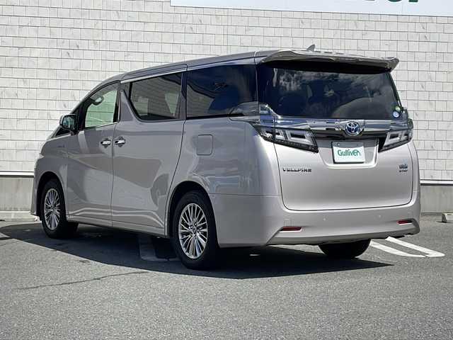 トヨタ ヴェルファイア ハイブリット V Lエディション 山形県 2018(平30)年 5.1万km スティールブロンドM 禁煙車/サンルーフ/レザーシート/Toyota Safety Sense/・プリクラッシュセーフティ/・レーントレーシングアシスト/・レーダークルーズコントロール/・ロードサインアシスト/・発進遅れ告知機能/・プロアクティブドライビングアシスト/・オートマチックハイビーム/JBLプレミアムサウンド/デジタルインナーミラー/ブラインドスポットモニター/クリアランスソナー/両側パワースライドドア/純正ナビ(CD.DVD.BT.USB.AUX)/パノラミックビューモニター/フルセグ/純正フリップダウンモニター/パワーバックドア/シートヒーター/ベンチレーション/パワーシート/ウッドコンビステアリング/電動パーキングブレーキ/オートホールド/LEDヘッドライト/プッシュスタート/スマートキー