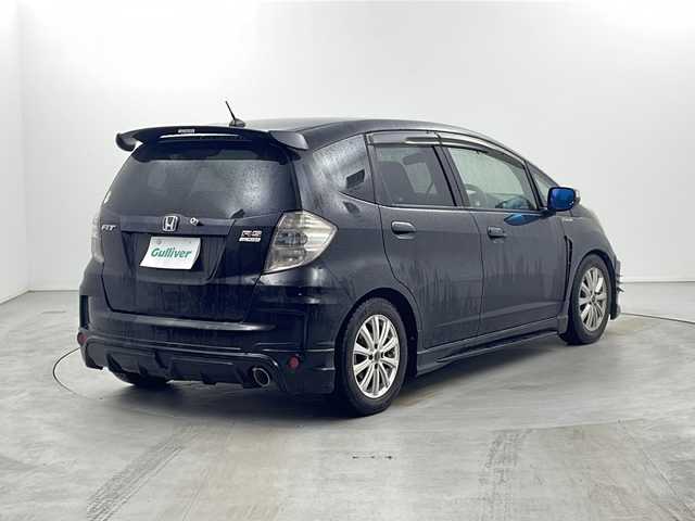 ホンダ フィット RS 栃木県 2010(平22)年 10.5万km クリスタルブラックパール 無限グリル/無限リアスポイラー/純正ナビ/　　CD/DVD/AM/FM/バックカメラ/ビルトインETC/純正フロアマット/レカロシート/オートライト/HID/リモコンキー/保証書・取説