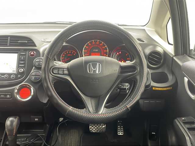 ホンダ フィット RS 栃木県 2010(平22)年 10.5万km クリスタルブラックパール 無限グリル/無限リアスポイラー/純正ナビ/　　CD/DVD/AM/FM/バックカメラ/ビルトインETC/純正フロアマット/レカロシート/オートライト/HID/リモコンキー/保証書・取説
