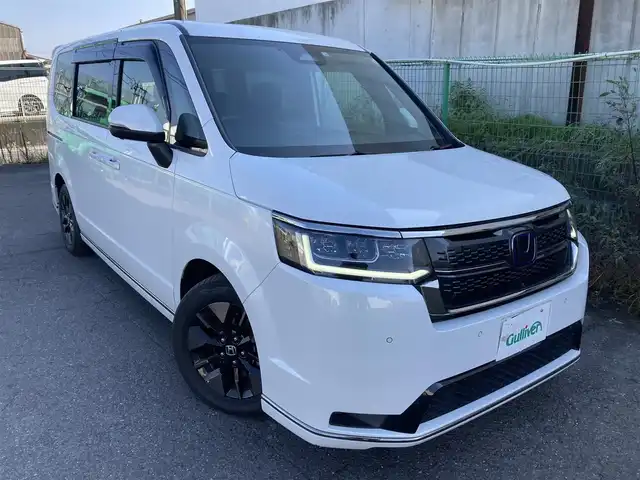 ホンダ ステップワゴン スパーダ eHEV 香川県 2022(令4)年 7.3万km プラチナホワイトパール 純正11.4型ナビ/フルセグTV/純正15.6型リア席モニター/両側パワースライドドア/マルチビューカメラ/ビルトインETC/アダプティブクルーズコントロール/ホンダセンシング/・衝突被害軽減ブレーキ/・車線逸脱防止支援/・前後誤発進抑制/・ブラインドスポットインフォメーション/・標識認識/・オートハイビーム/LEDヘッドランプ/革巻きステアリング/パドルシフト/合皮/撥水加工ファブリックコンビシート/前席シートヒーター/2列目キャプテンシート/オットマン/純正16インチアルミホイール/スマートキー/プッシュエンジンスタート/禁煙車