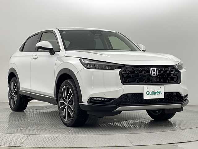 ホンダ ヴェゼル ハイブリッド e:HEV Z 新潟県 2025(令7)年 0.1万km未満 プラチナホワイトパール 4WD/ホンダセンシング/純正ナビ/　　フルセグ/BT/USB/AppleCarPlay/AndroidAuto/バックカメラ/パワーバックドア/レーダークルーズコントロール/LEDオートライト/Fフォグ/ハーフレザーシート/シートヒーター/純正18インチアルミホイール/パドルシフト/ステアリングスイッチ/ステリングヒーター/USBポート/TypeCポート/置くだけ充電/ブラインドスポットモニター/スマートキー/ビルトインETC2.0